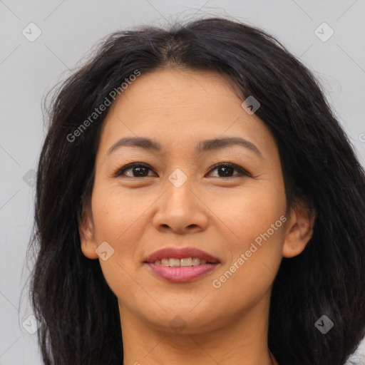 Joyful asian young-adult female with long  brown hair and brown eyes