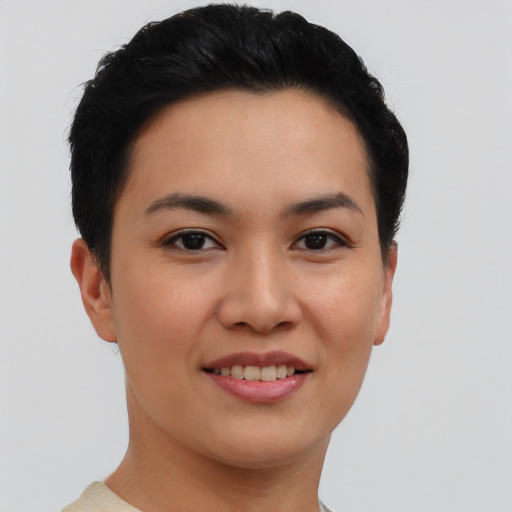 Joyful asian young-adult female with short  black hair and brown eyes
