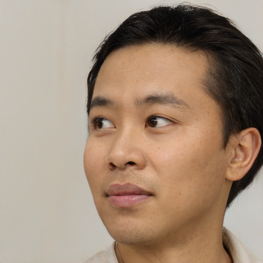 Neutral asian young-adult male with short  black hair and brown eyes