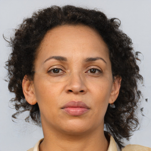 Neutral black adult female with medium  brown hair and brown eyes