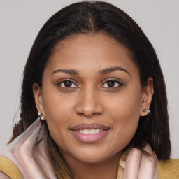 Joyful black young-adult female with medium  brown hair and brown eyes