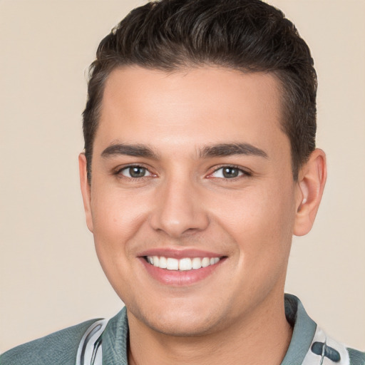 Joyful white young-adult male with short  brown hair and brown eyes