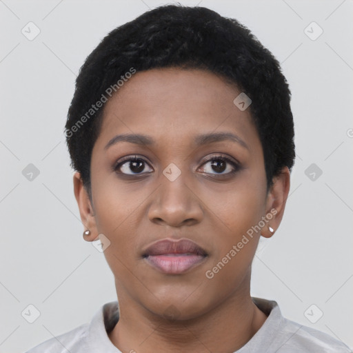 Joyful black young-adult female with short  black hair and brown eyes