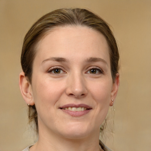 Joyful white young-adult female with medium  brown hair and brown eyes