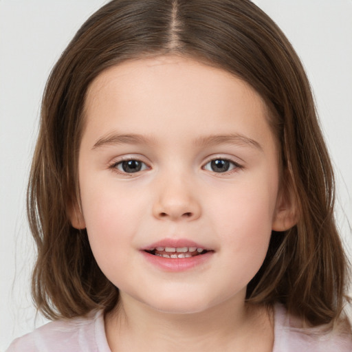 Joyful white child female with medium  brown hair and brown eyes