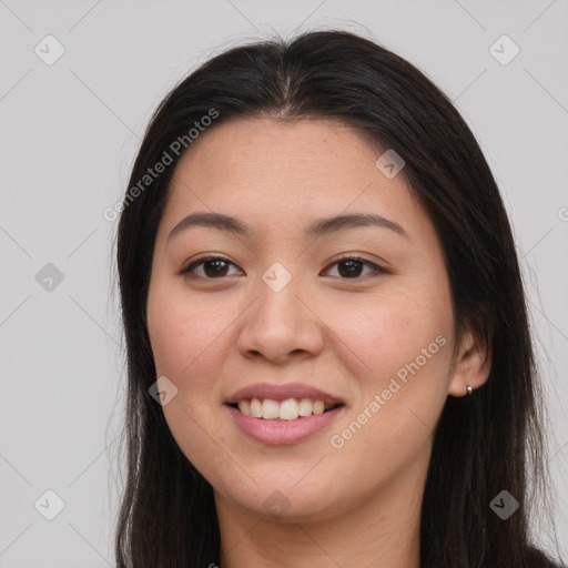 Joyful asian young-adult female with long  brown hair and brown eyes