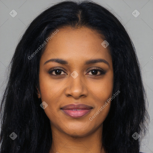 Joyful black young-adult female with long  black hair and brown eyes