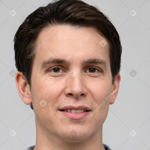 Joyful white adult male with short  brown hair and brown eyes