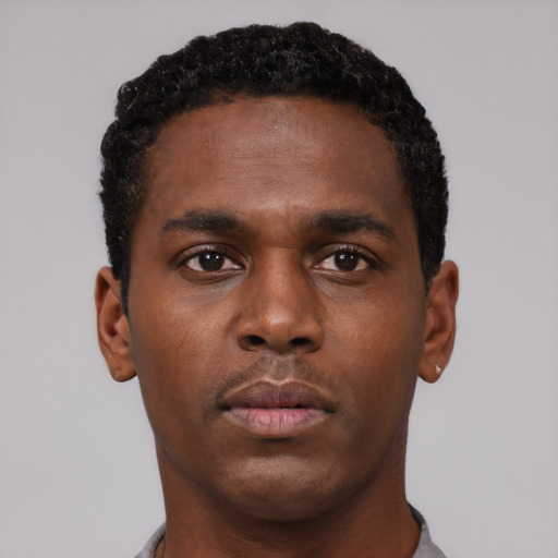 Neutral black young-adult male with short  brown hair and brown eyes