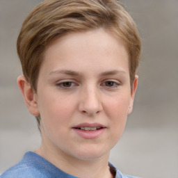 Joyful white child female with short  brown hair and grey eyes