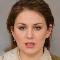 Joyful white young-adult female with medium  brown hair and blue eyes