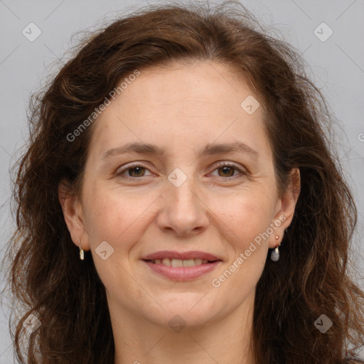 Joyful white adult female with long  brown hair and brown eyes