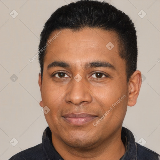 Joyful latino adult male with short  black hair and brown eyes