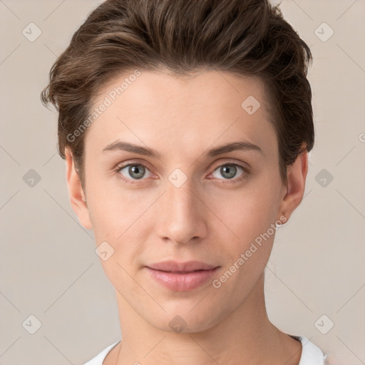 Joyful white young-adult female with short  brown hair and grey eyes