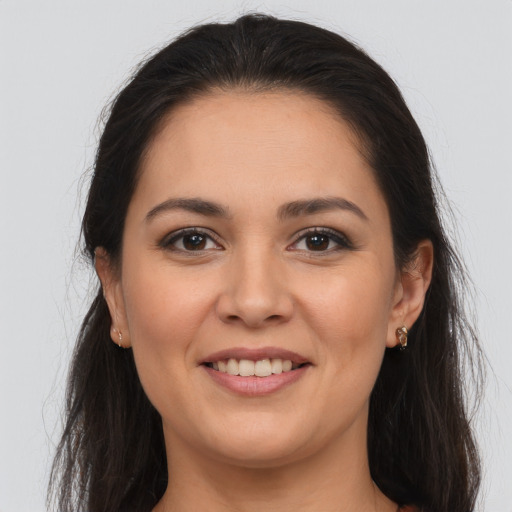 Joyful white young-adult female with long  brown hair and brown eyes