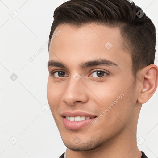 Joyful white young-adult male with short  brown hair and brown eyes