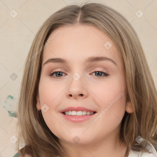 Joyful white child female with medium  brown hair and brown eyes