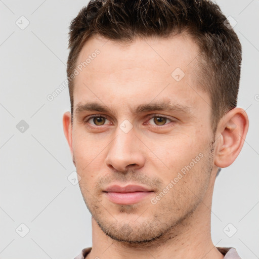 Joyful white young-adult male with short  brown hair and brown eyes