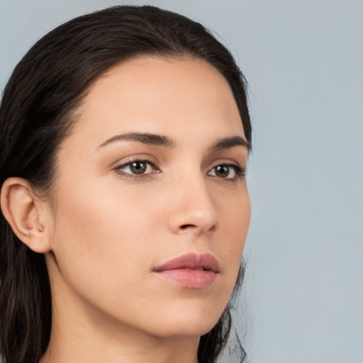 Neutral white young-adult female with long  brown hair and brown eyes