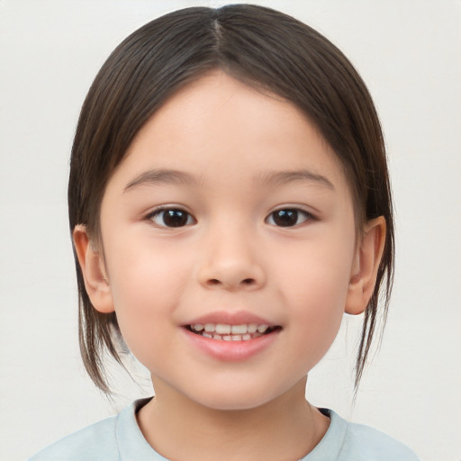 Joyful white child female with medium  brown hair and brown eyes