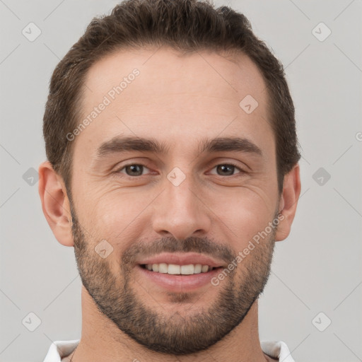 Joyful white young-adult male with short  brown hair and brown eyes