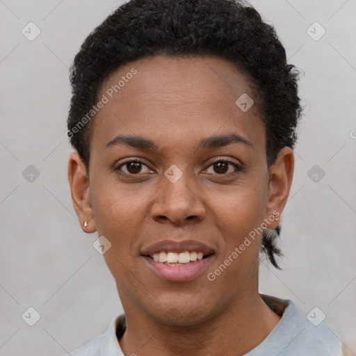 Joyful black young-adult female with short  black hair and brown eyes