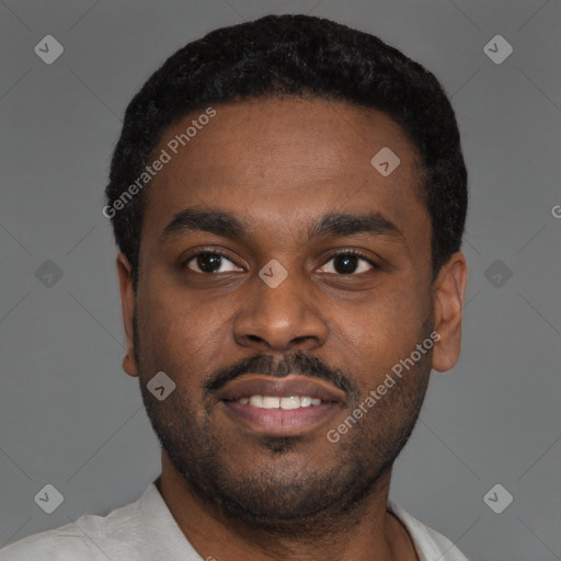 Joyful black young-adult male with short  black hair and brown eyes