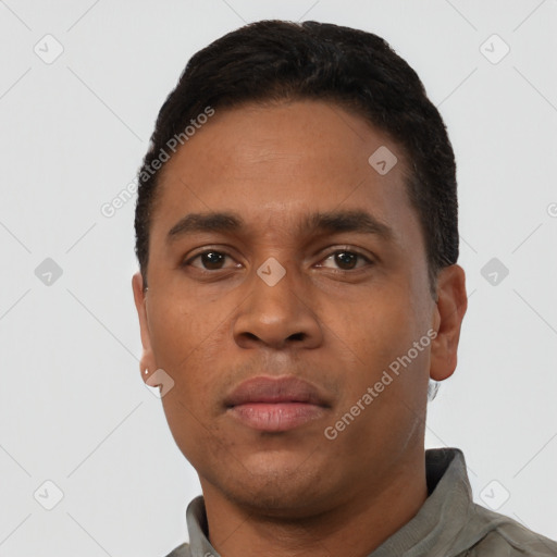 Neutral latino young-adult male with short  black hair and brown eyes