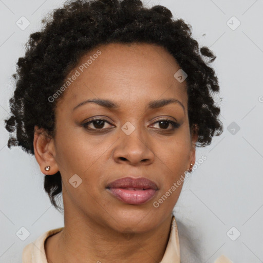 Joyful black adult female with short  brown hair and brown eyes