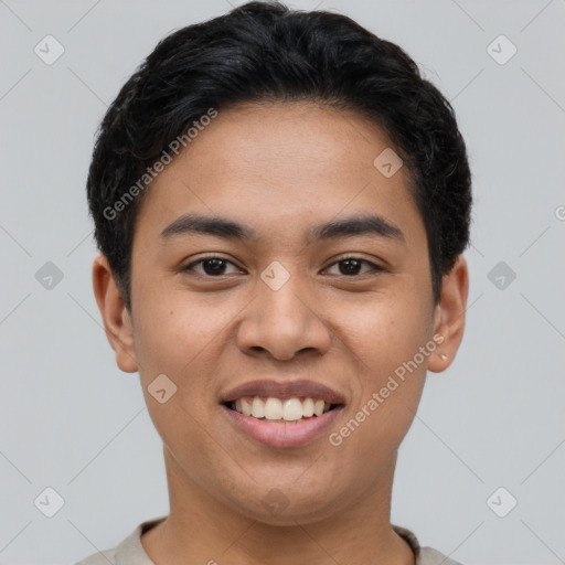 Joyful latino young-adult male with short  brown hair and brown eyes