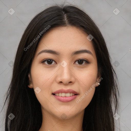 Joyful asian young-adult female with long  brown hair and brown eyes