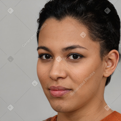 Joyful latino young-adult female with short  brown hair and brown eyes