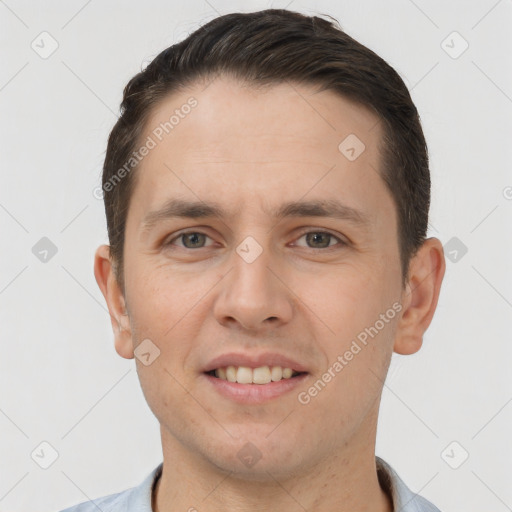 Joyful white young-adult male with short  brown hair and brown eyes