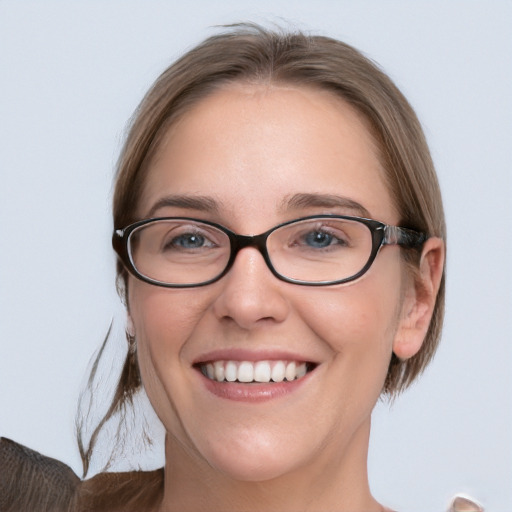 Joyful white young-adult female with medium  brown hair and blue eyes