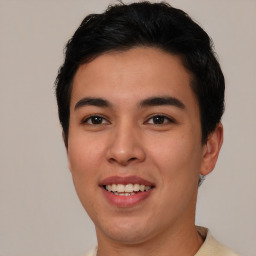 Joyful asian young-adult male with short  brown hair and brown eyes