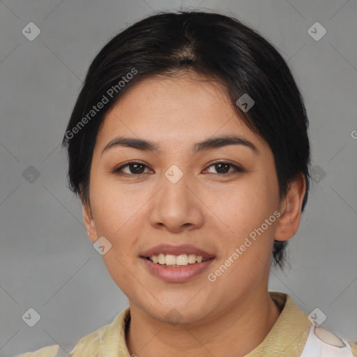 Joyful asian young-adult female with short  brown hair and brown eyes