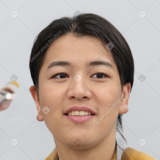 Joyful asian young-adult female with short  brown hair and brown eyes