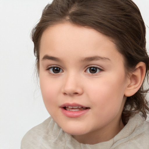 Joyful white child female with medium  brown hair and brown eyes