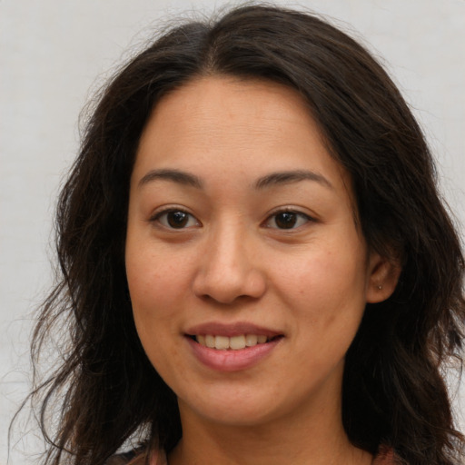 Joyful white young-adult female with long  brown hair and brown eyes