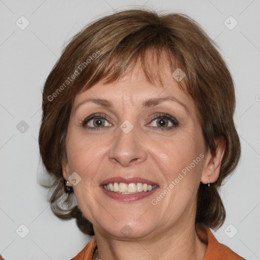 Joyful white adult female with medium  brown hair and blue eyes