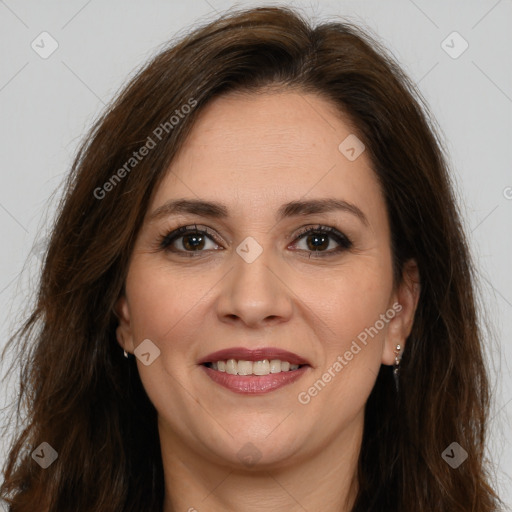 Joyful white adult female with long  brown hair and brown eyes