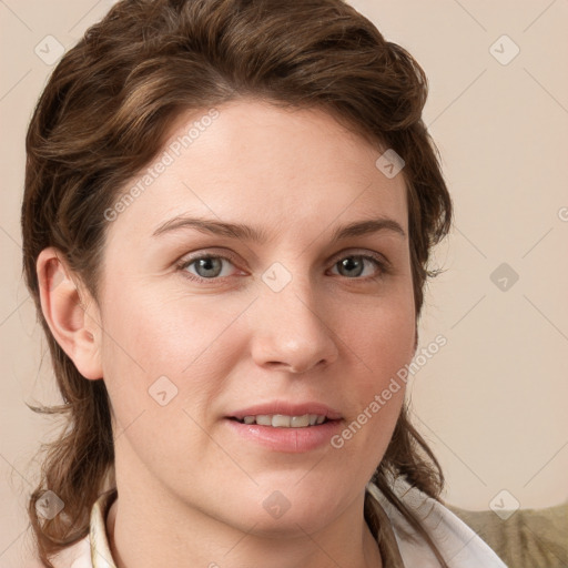 Joyful white young-adult female with medium  brown hair and blue eyes