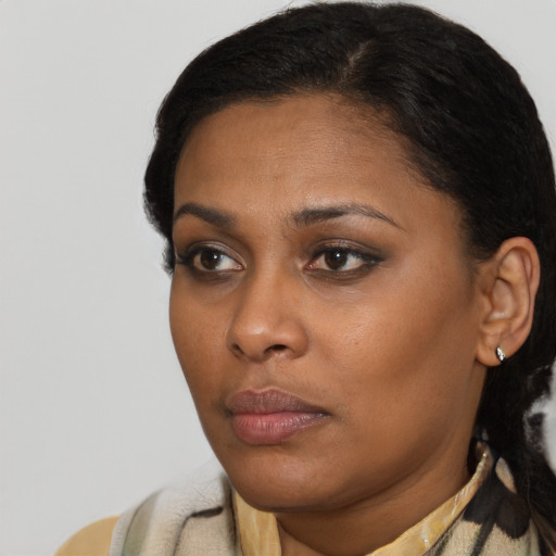 Neutral black young-adult female with short  black hair and brown eyes