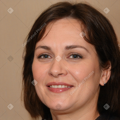 Joyful white adult female with medium  brown hair and brown eyes