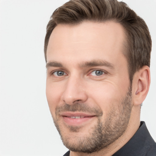 Joyful white adult male with short  brown hair and brown eyes