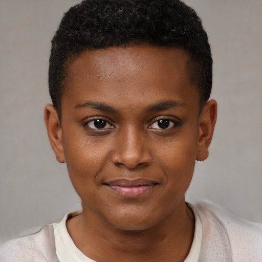 Joyful black child female with short  brown hair and brown eyes