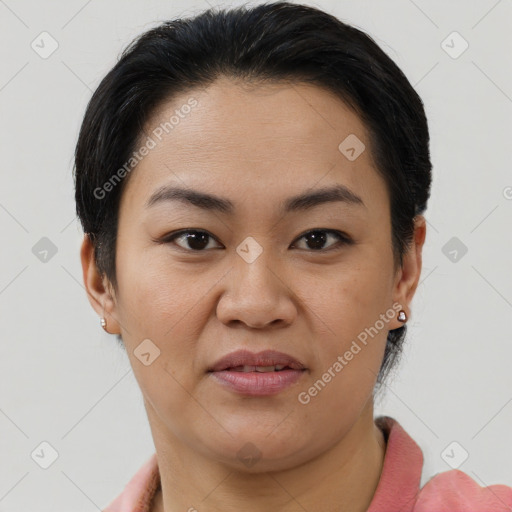 Joyful latino young-adult female with short  brown hair and brown eyes