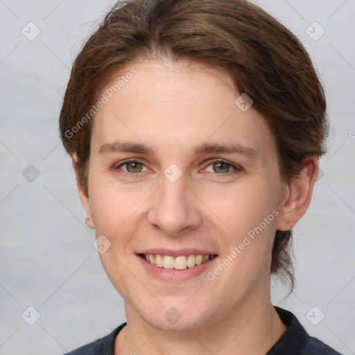 Joyful white young-adult female with short  brown hair and grey eyes