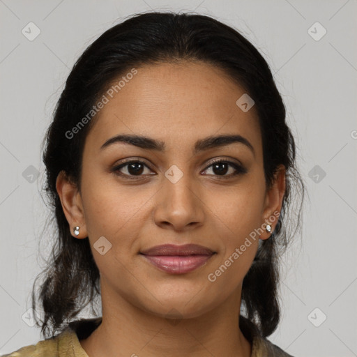 Joyful latino young-adult female with medium  brown hair and brown eyes