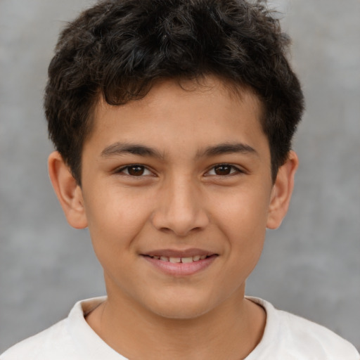 Joyful white child male with short  brown hair and brown eyes
